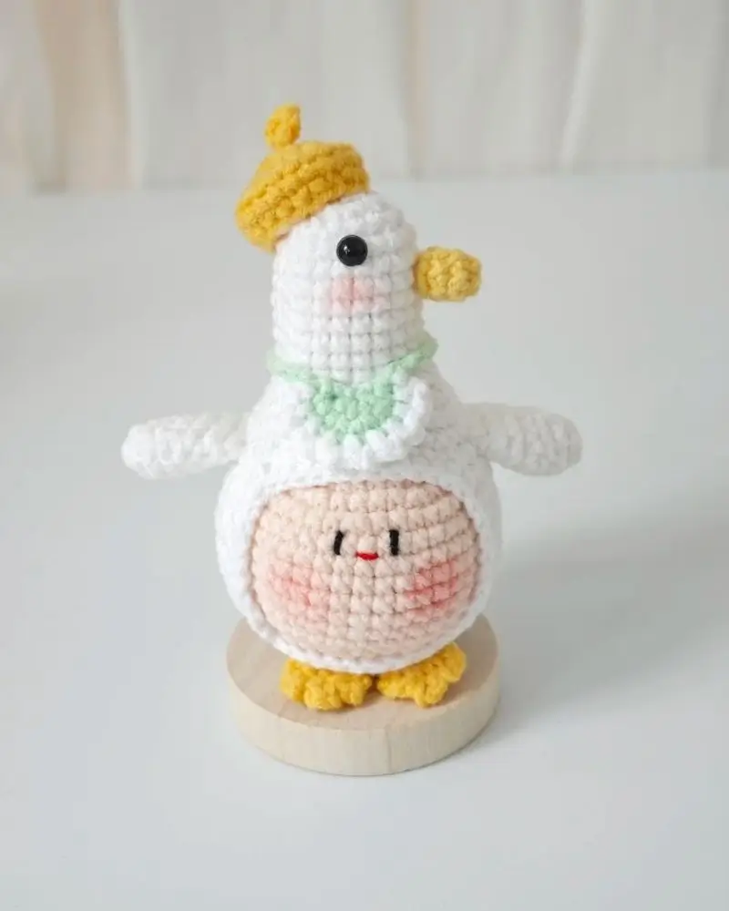 Cute crocheted bird wearing a beret.