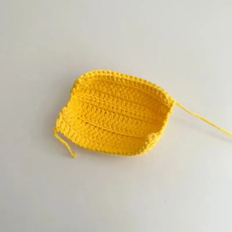 Crocheted yellow  bowl/hat  blank.
