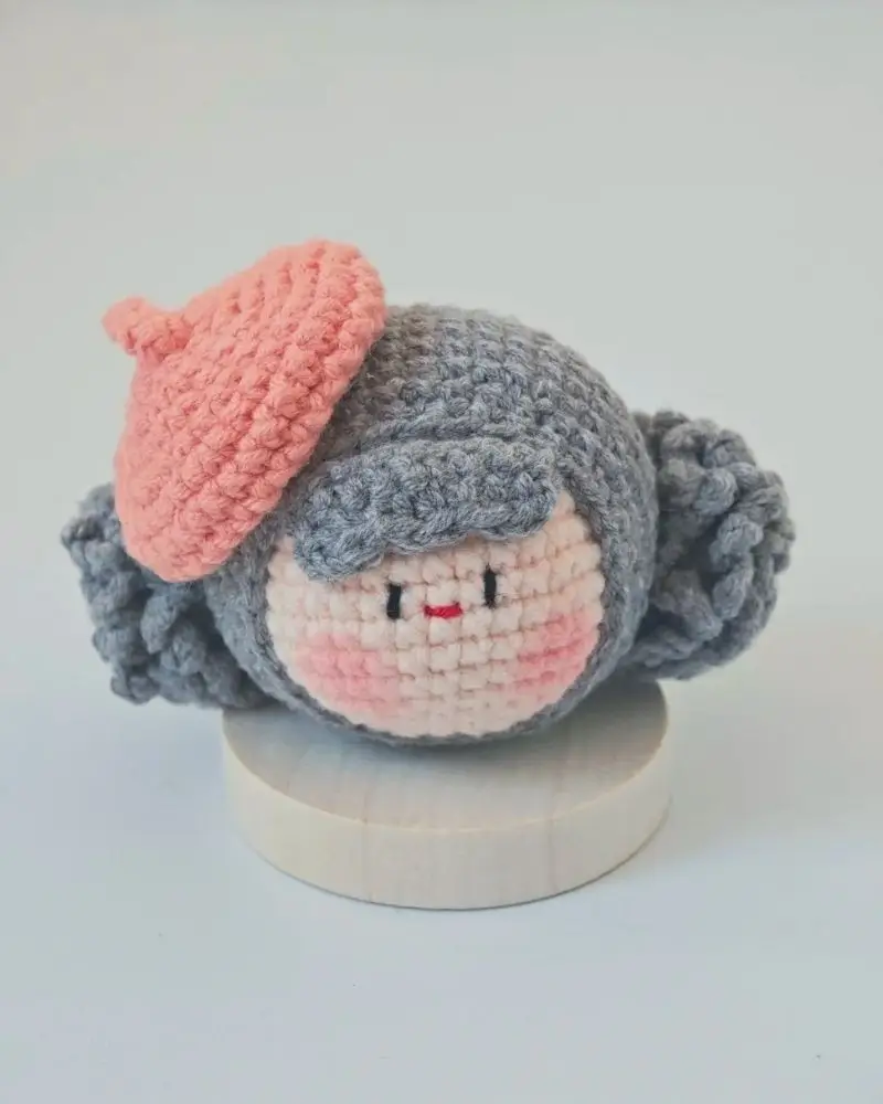 Crocheted doll, beret,  cute face.