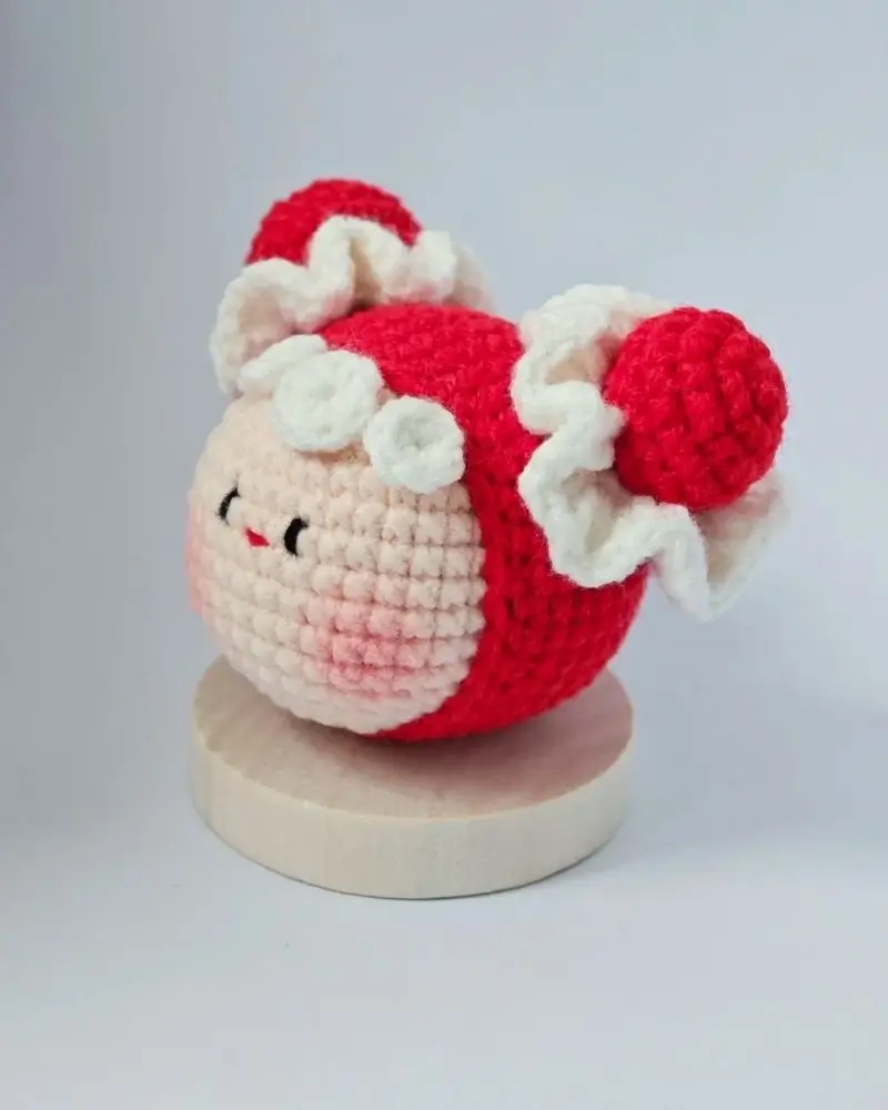 Cute crocheted doll, red and white.
