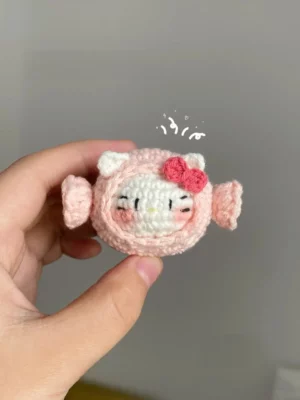 Pink crocheted Hello Kitty-style candy.