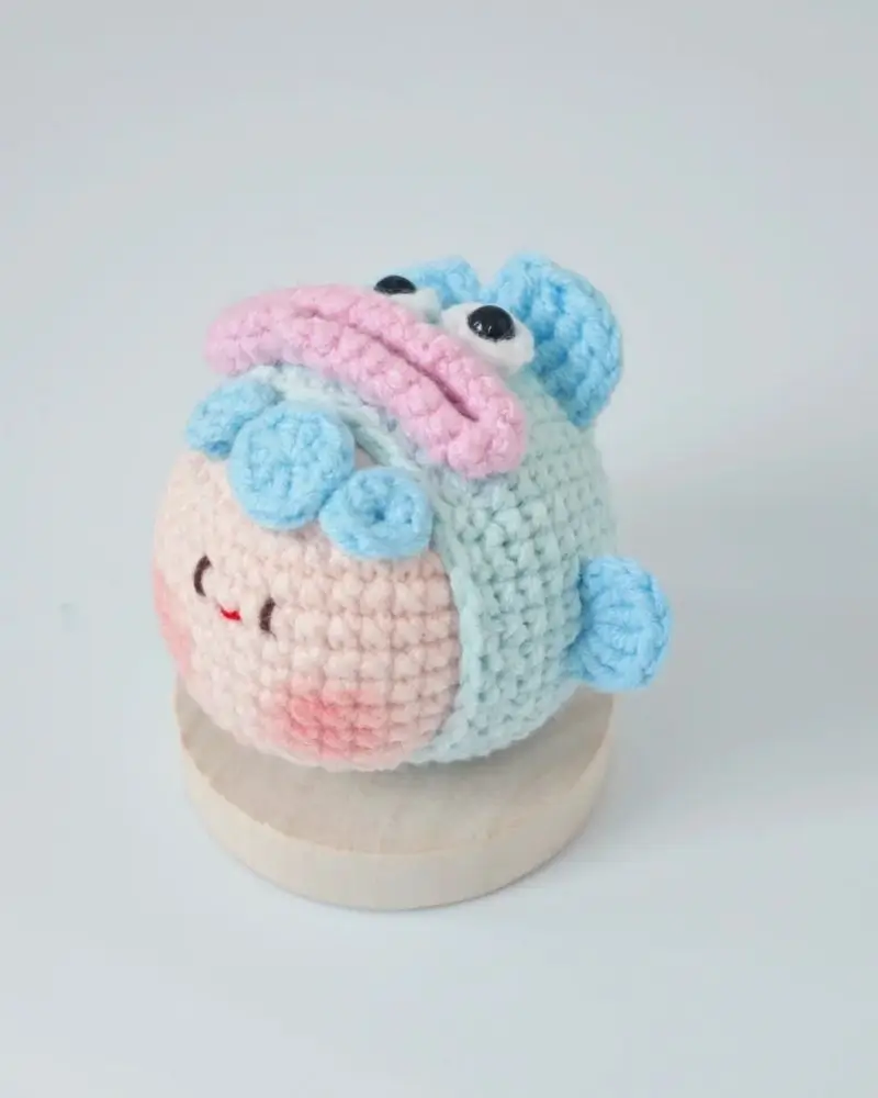 Cute crocheted pastel fish figurine.