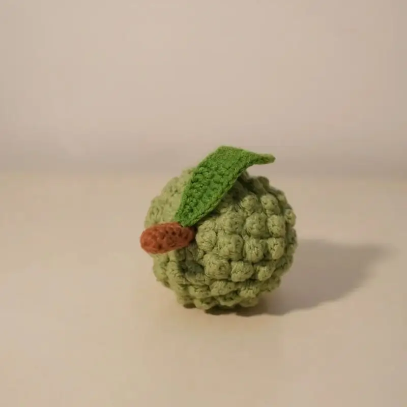 Crocheted green star fruit.