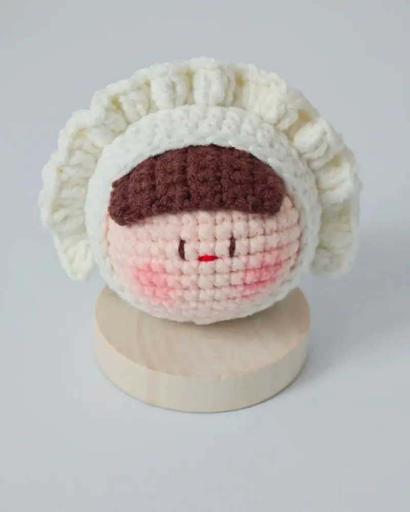 Crocheted doll, chef hat,  cute face.