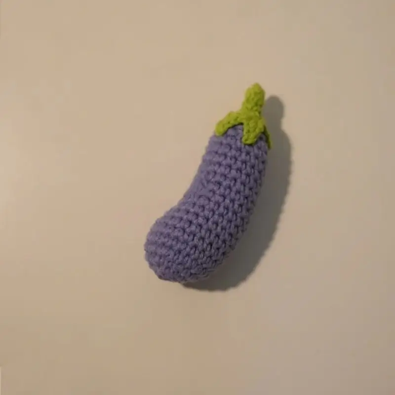 Crocheted purple eggplant.