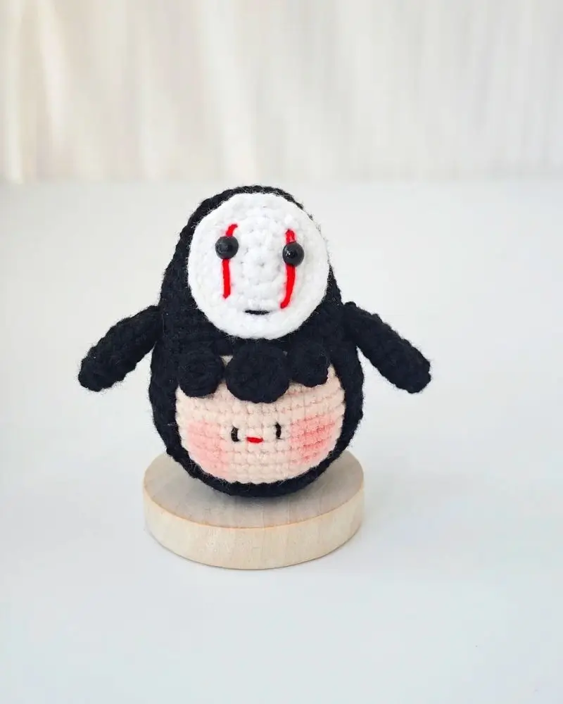 Crochet amigurumi, black and white,  red eyes.