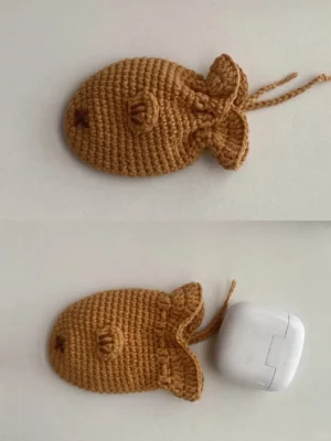 Crochet fish-shaped case for wireless earbuds.