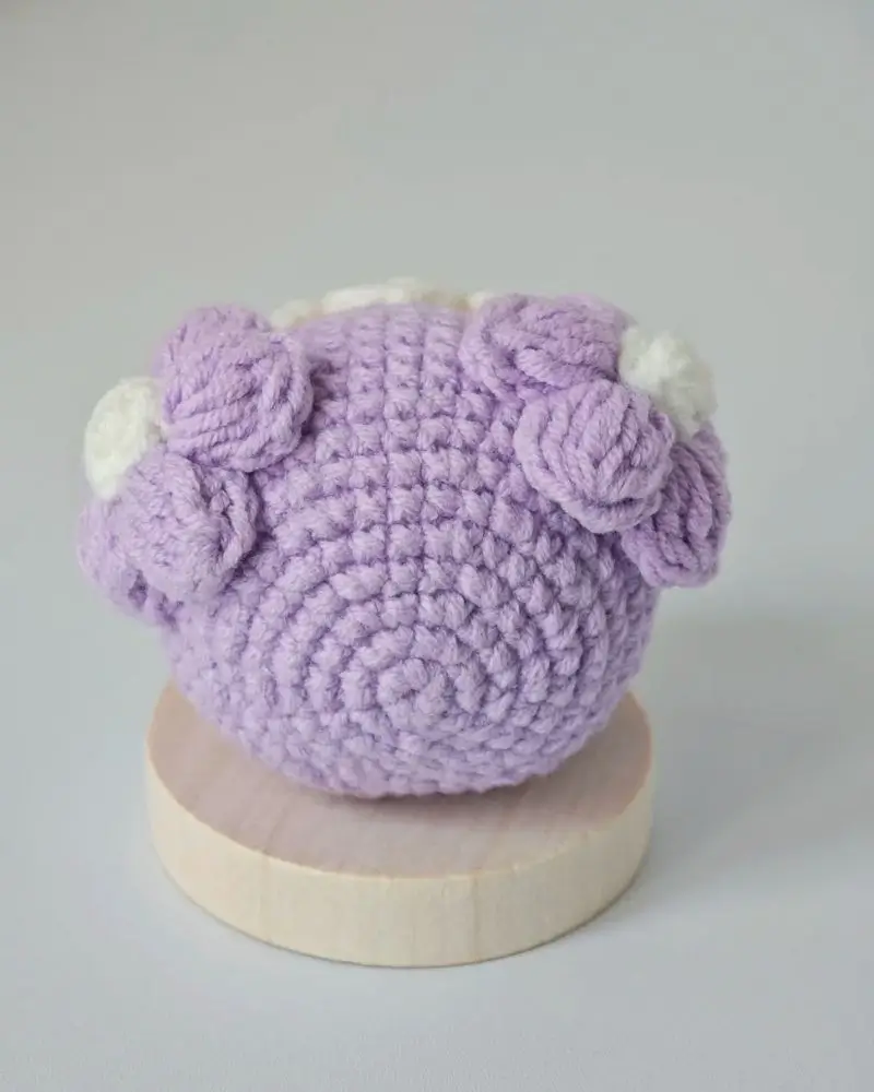 Crocheted purple animal head, decorative.