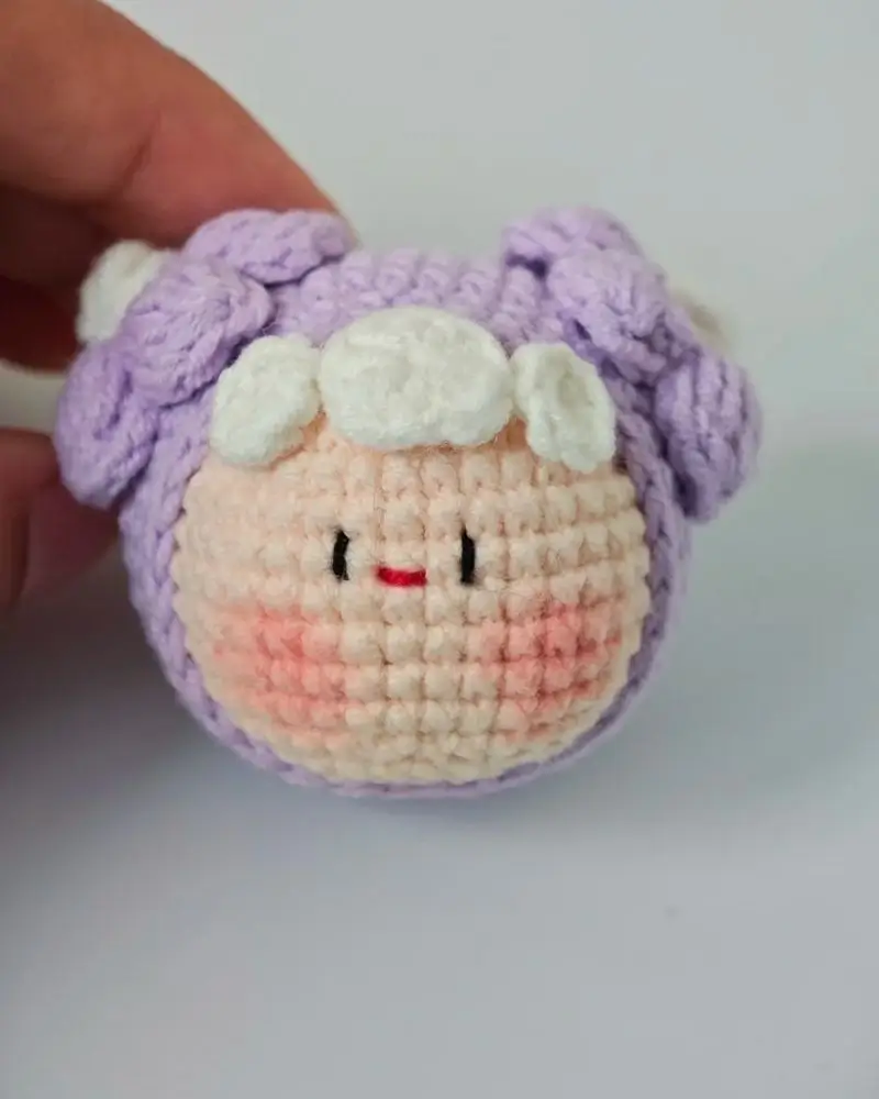Crocheted sheep,  purple and white,  cute amigurumi.