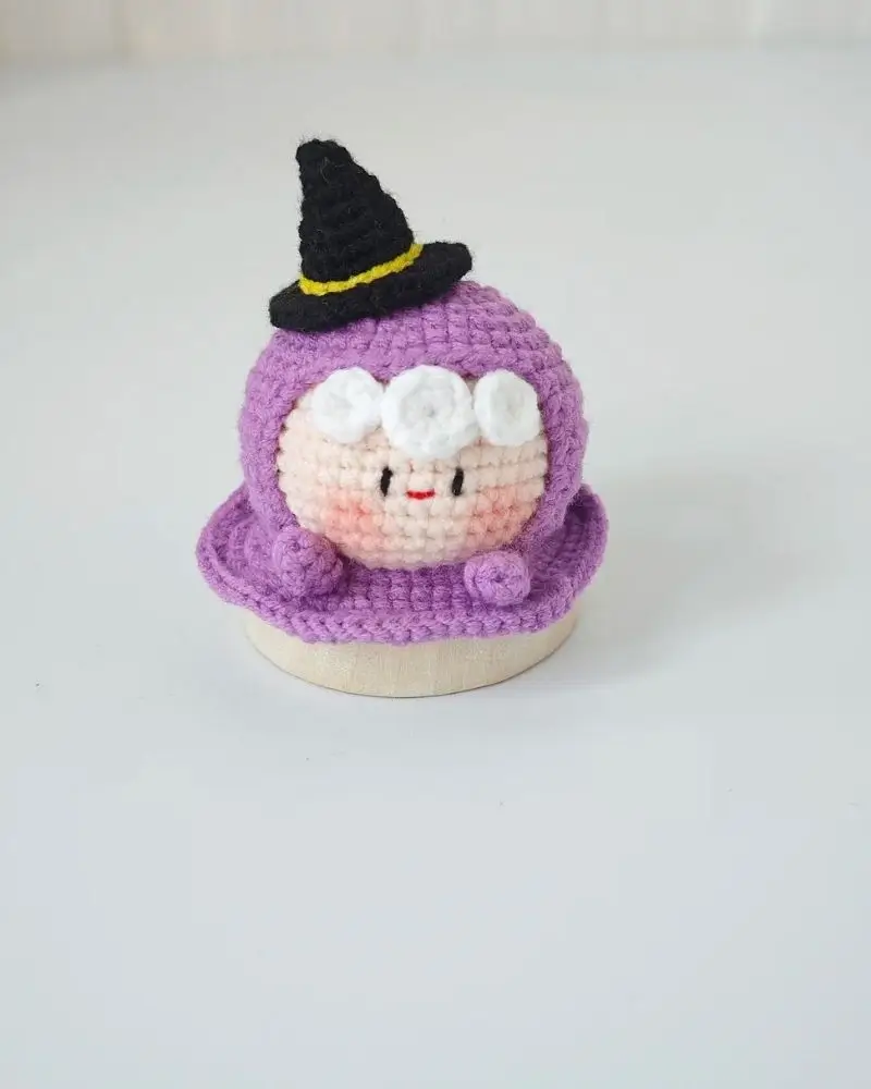 Crochet witch doll, purple, black hat.