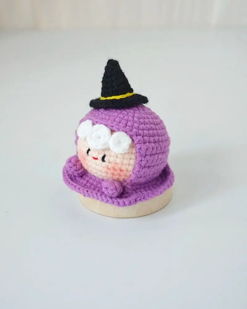 Cute crocheted witch, purple, black hat.