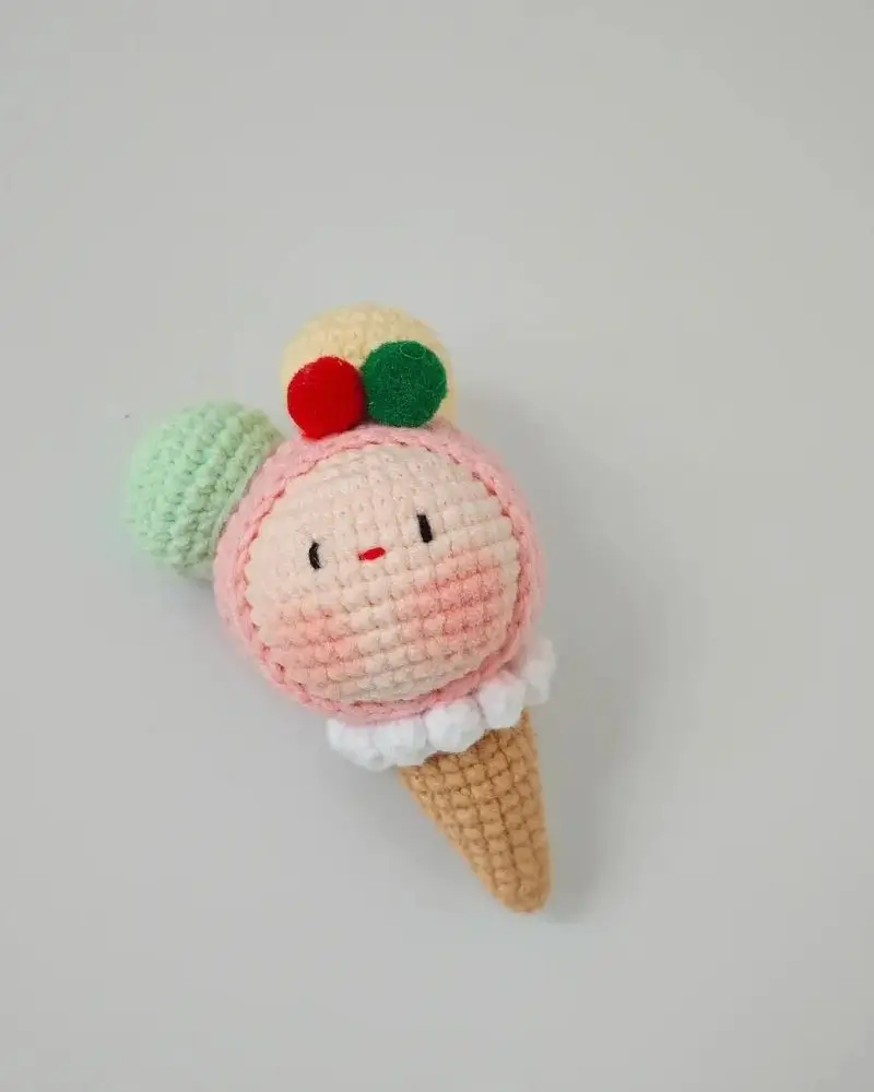 Cute crocheted ice cream cone toy.