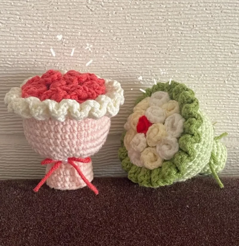 Two crocheted flower bouquets, pink and light green.