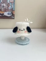 Crocheted lamp, cartoon dog, white, light blue base.