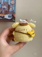 Crocheted yellow amigurumi, small, cute.