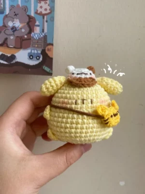 Crocheted yellow amigurumi, small, cute.