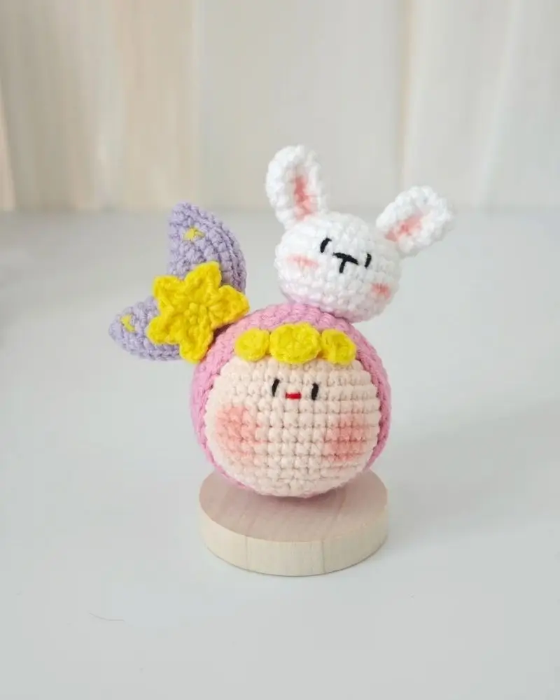 Crocheted amigurumi, rabbit & moon, pink & white.