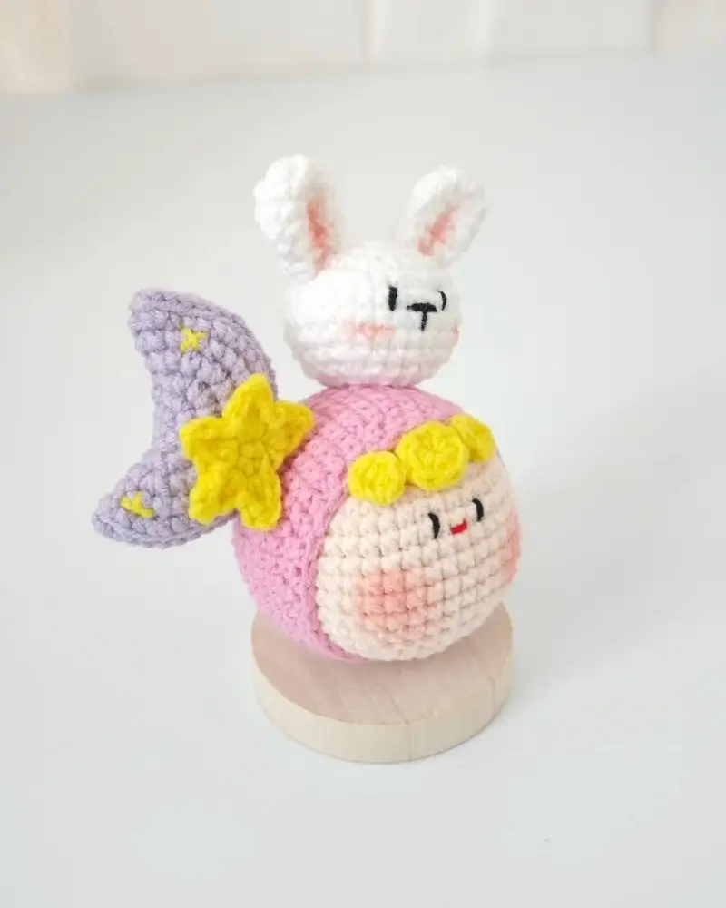Cute crocheted bunny and moon character.