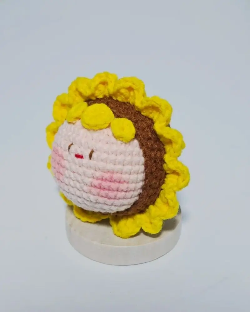 Crocheted sunflower,  pink and brown, yellow details.