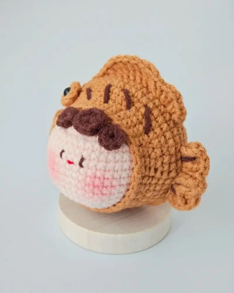 Cute crocheted takoyaki fish figurine.
