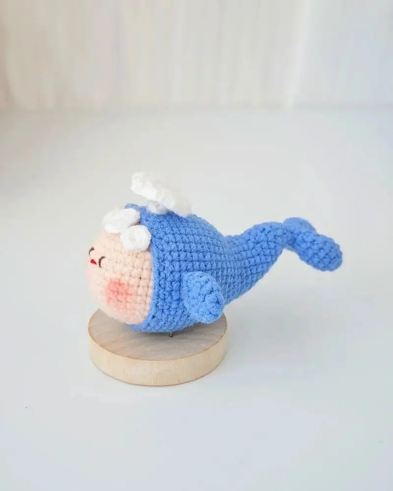 Crocheted blue whale toy, cute design.