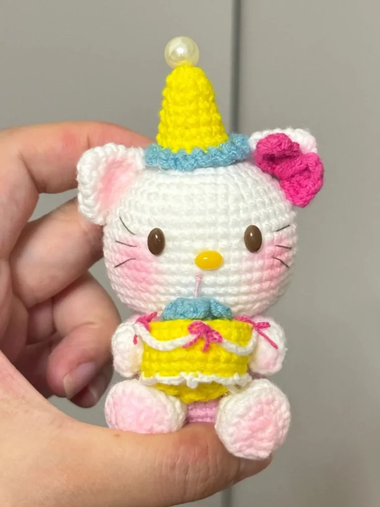 Crocheted Hello Kitty, birthday hat, pink bow.