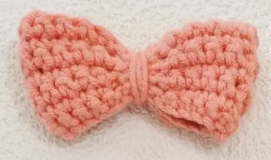 Crocheted pink bow.