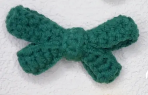 Teal crocheted bow.