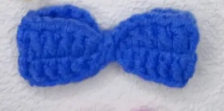 Blue crocheted bow.