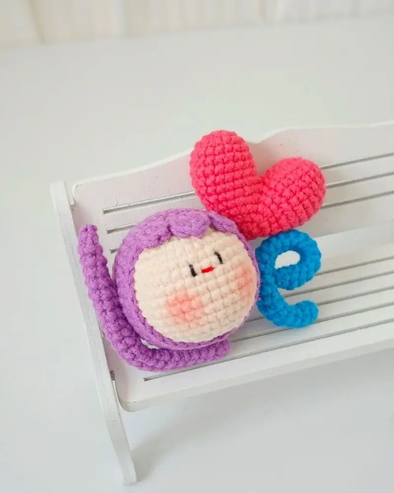 Crocheted "love" word art, cute characters.