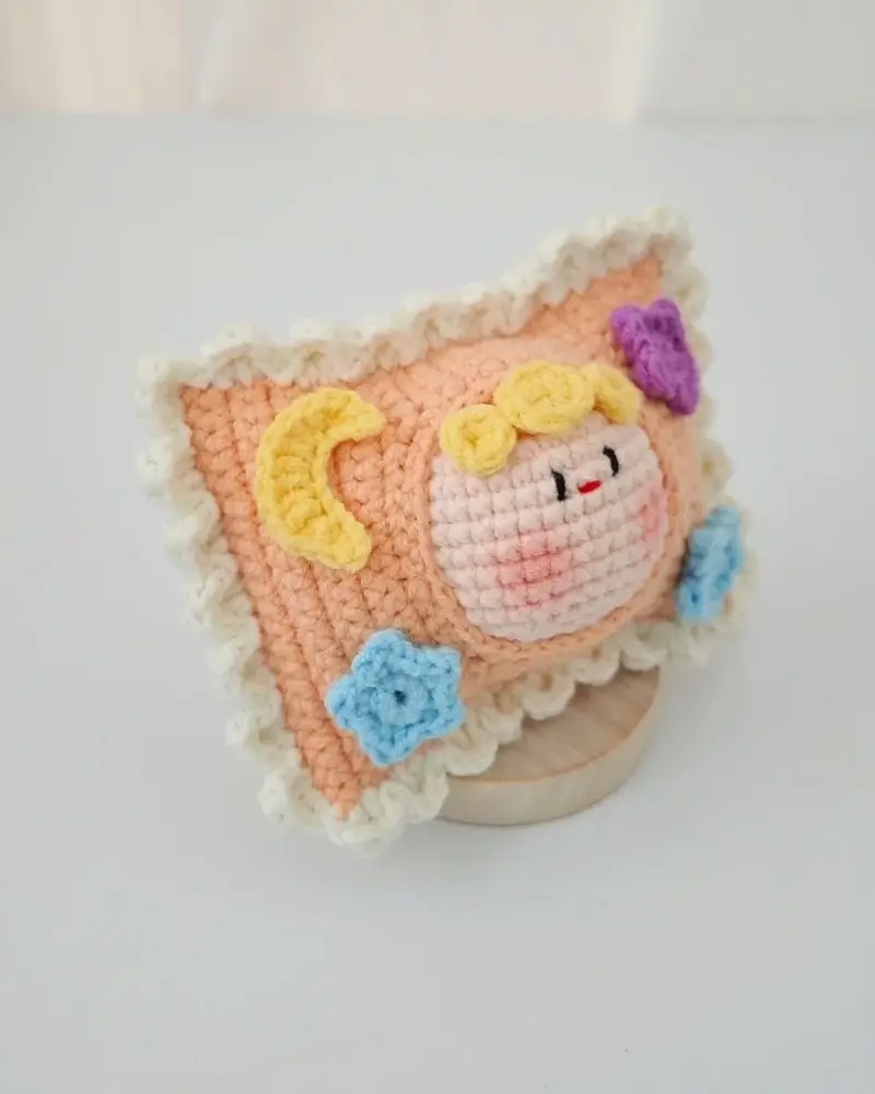 Crochet pillow, pastel orange, decorative.