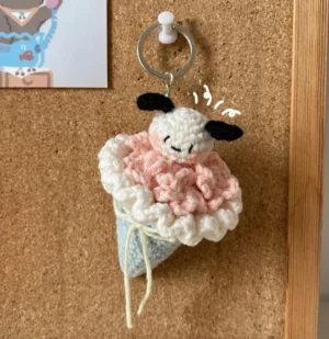 Crochet ice cream cone keychain, pink and light blue.