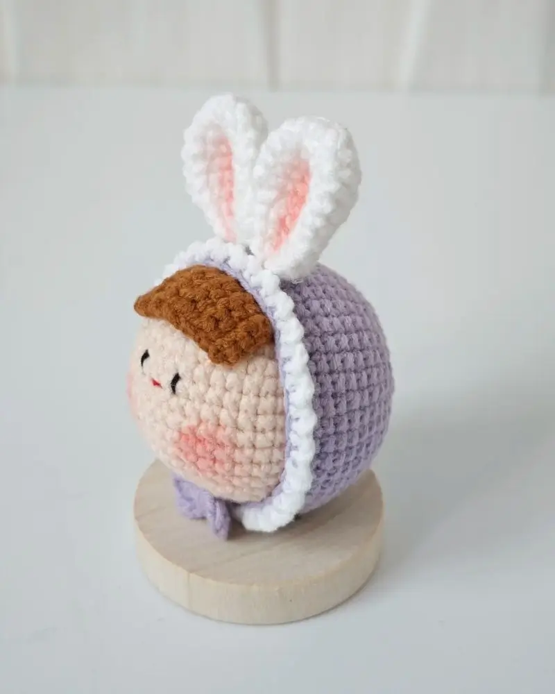Crocheted bunny rabbit doll, pastel purple.