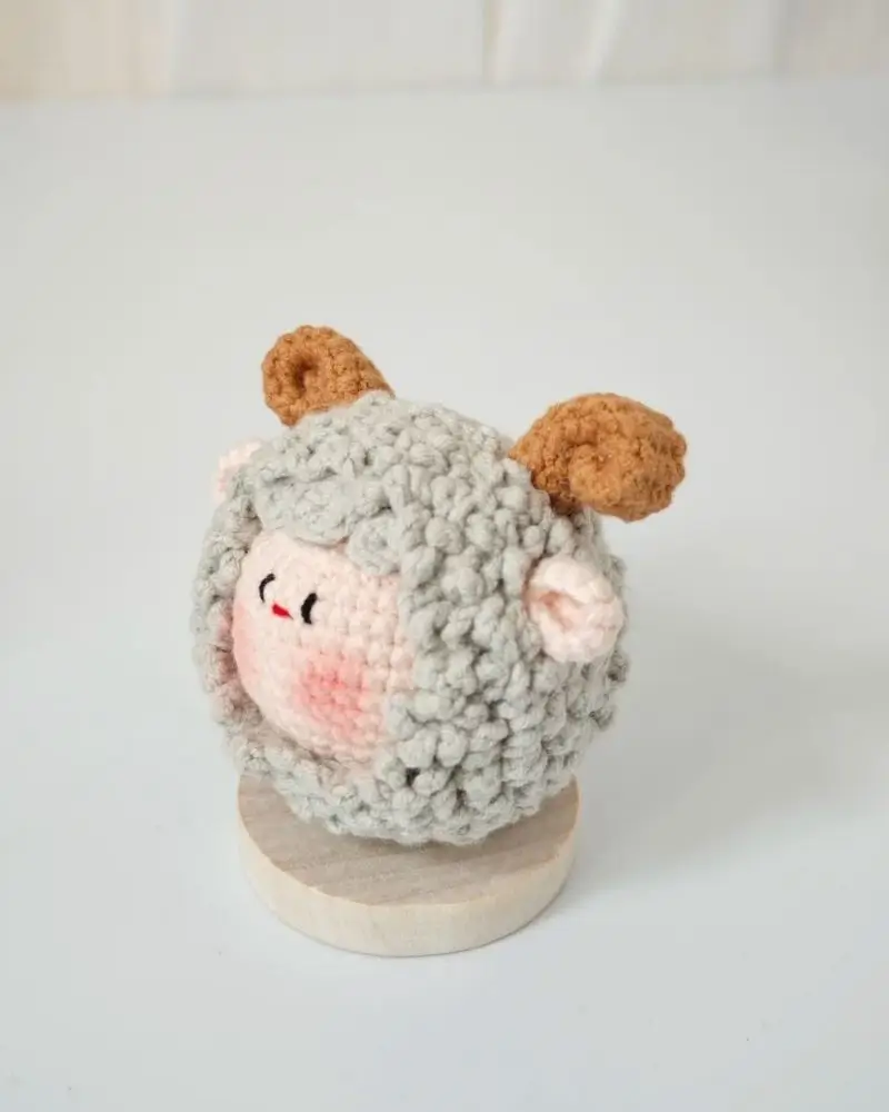 Cute crocheted sheep figurine.