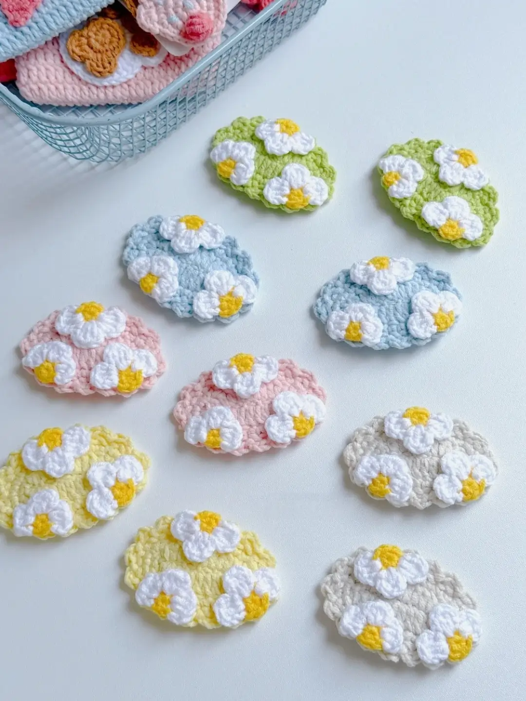Crochet flower hair clips, various colors.