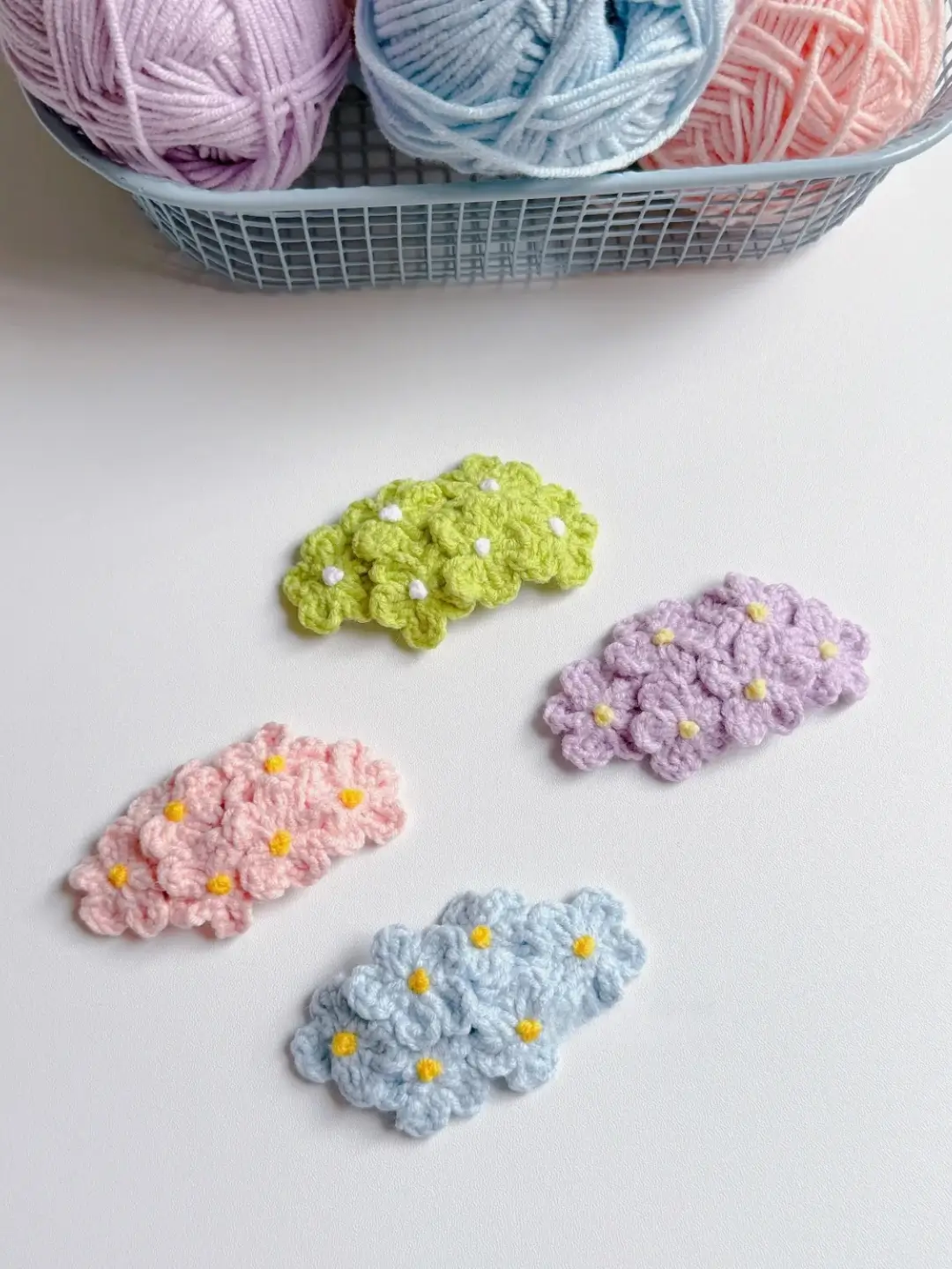 Crocheted flower hair clips in pastel colors.
