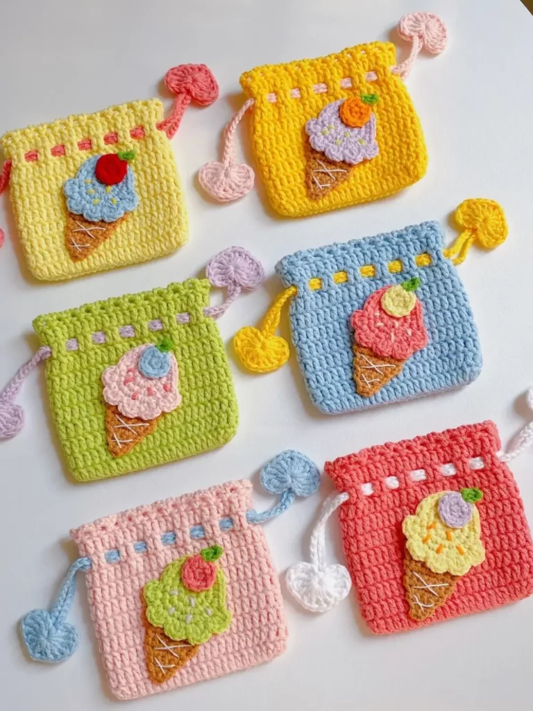 Colorful crocheted ice cream cone pouches.