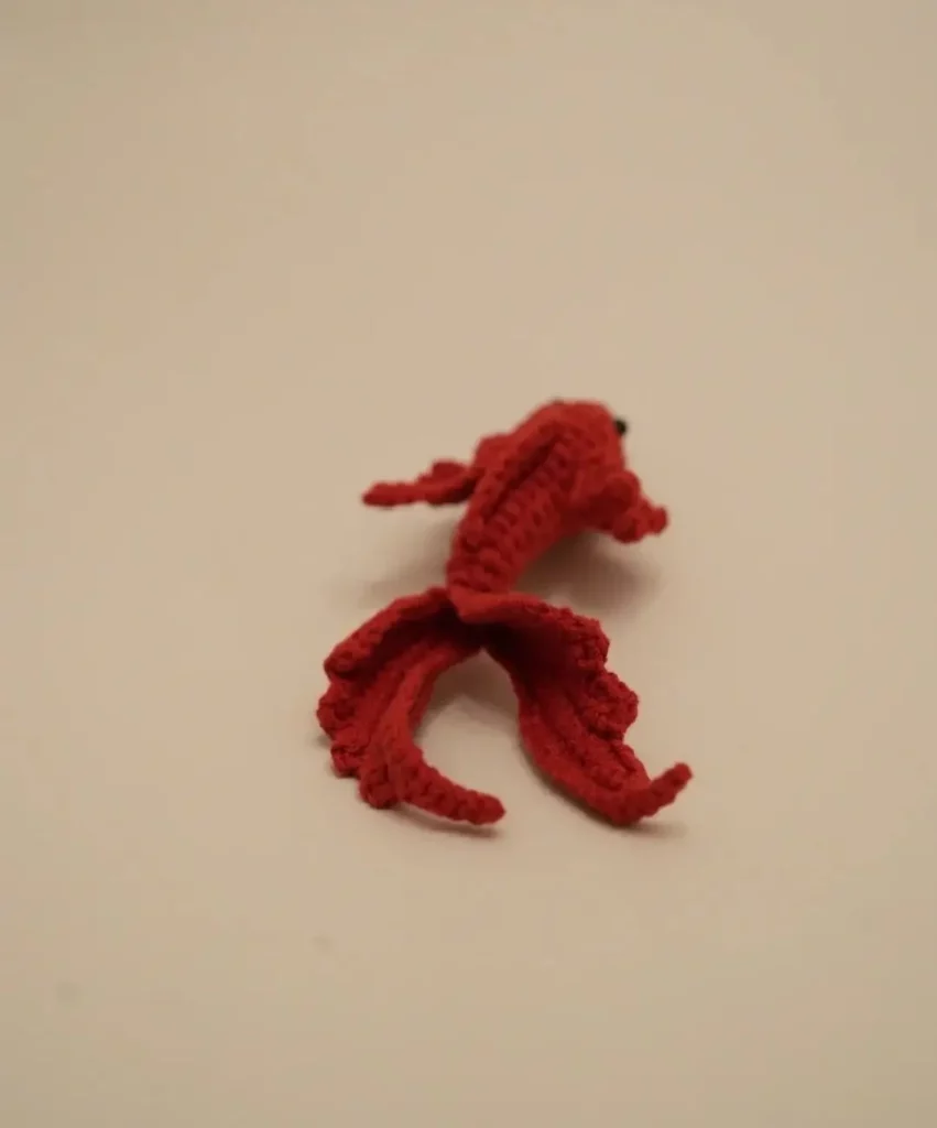 Crocheted red goldfish.