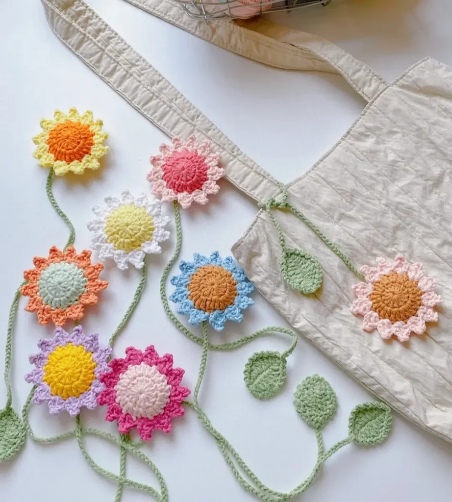 Crochet flower garland, pastel colors, beige tote bag.