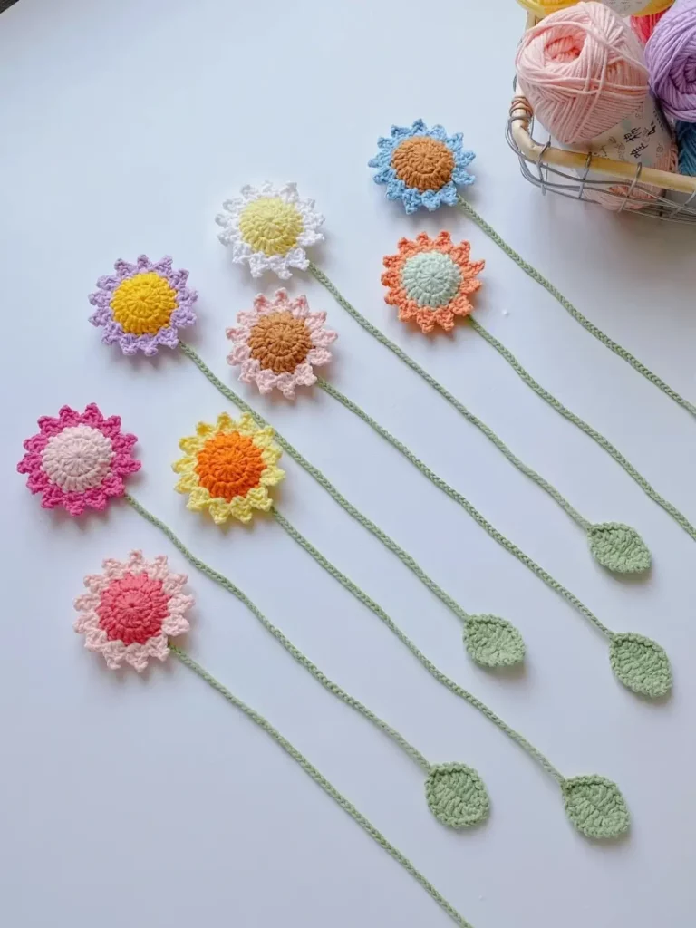 Crocheted flower and leaf wall art, various colors.