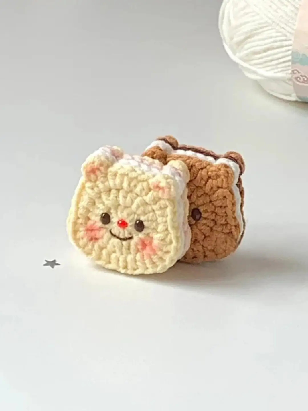 Crocheted sandwich-shaped animal toys, light yellow and brown.