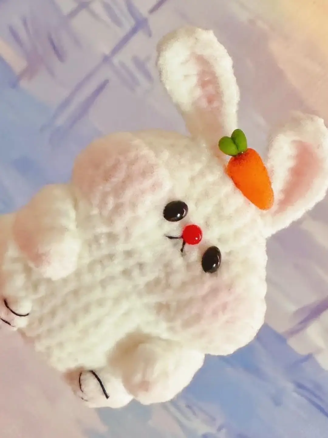 Cute crocheted white rabbit with carrot.  Handmade stuffed animal.