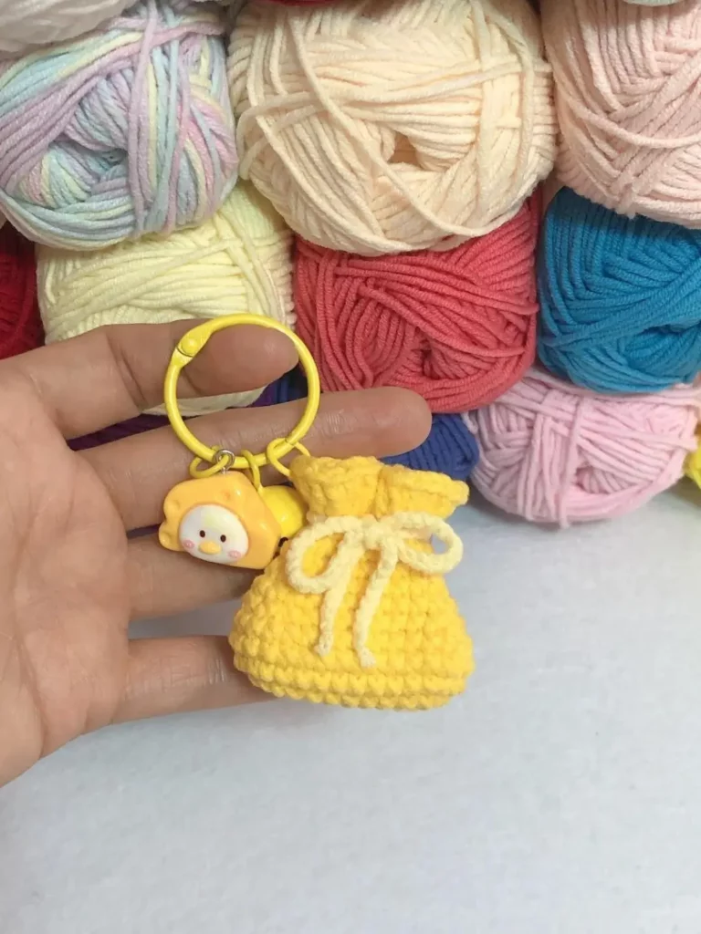 Small yellow crocheted bag keychain,  cute design.
