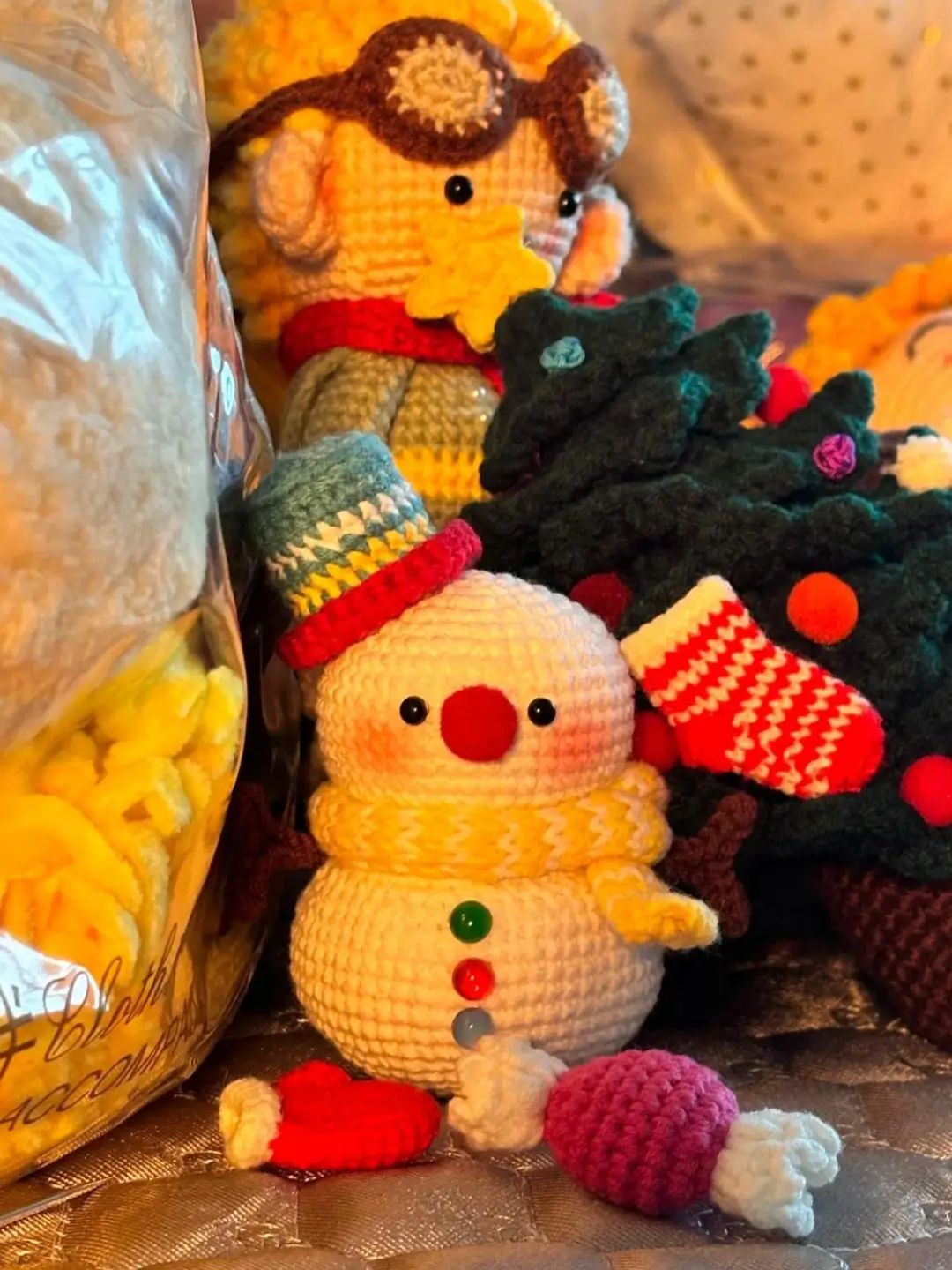 Crocheted snowman, Christmas tree, and aviator toys.  Holiday amigurumi.