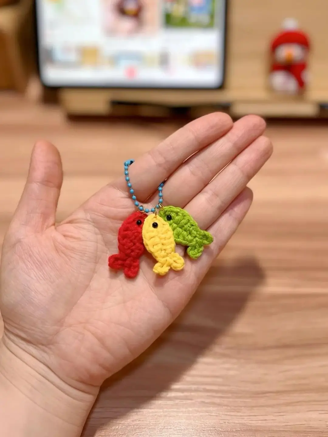 Crochet fish keychain, red, yellow, green.
