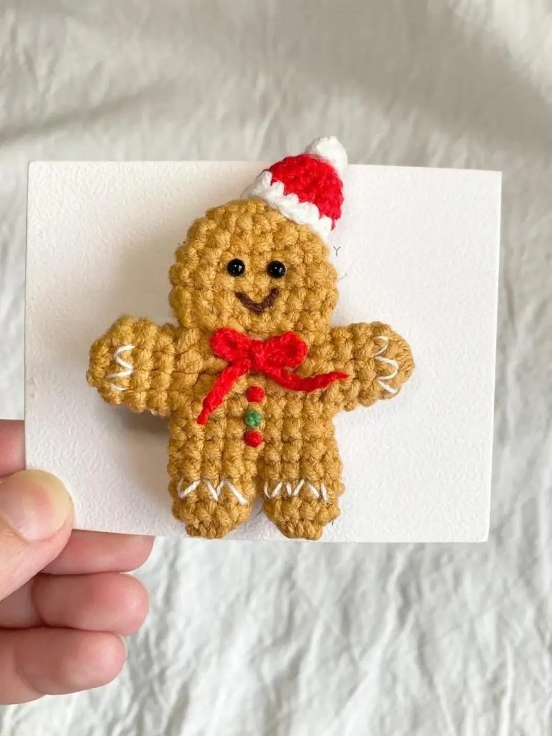 Crochet gingerbread man Christmas ornament.