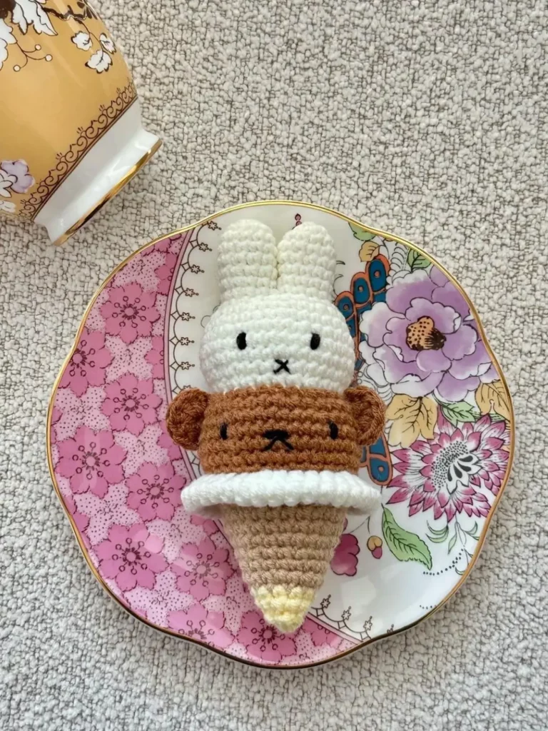 Crocheted ice cream cone with bunny and bear.