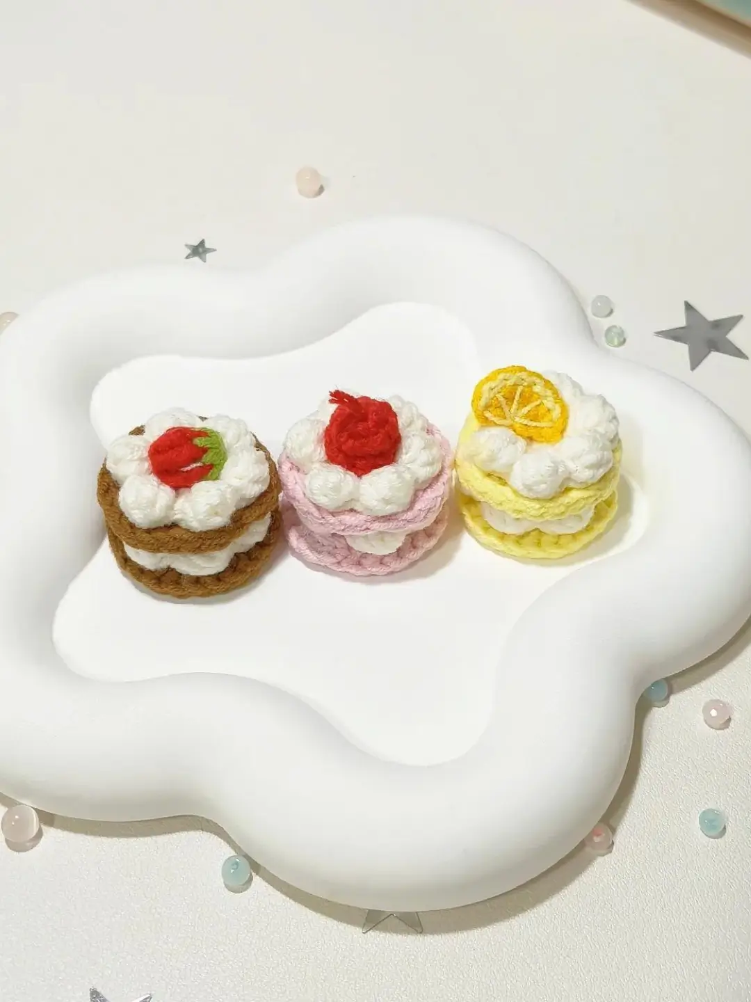 Crocheted mini cakes, strawberry, lemon, pink.