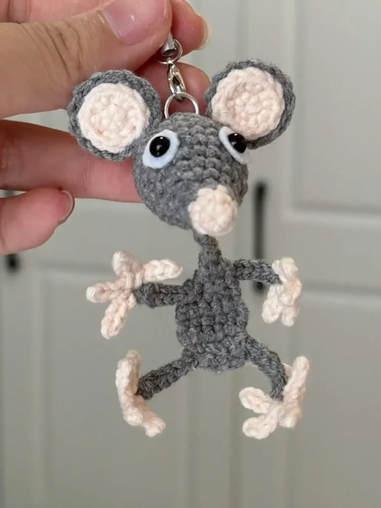 Crocheted gray mouse keychain.