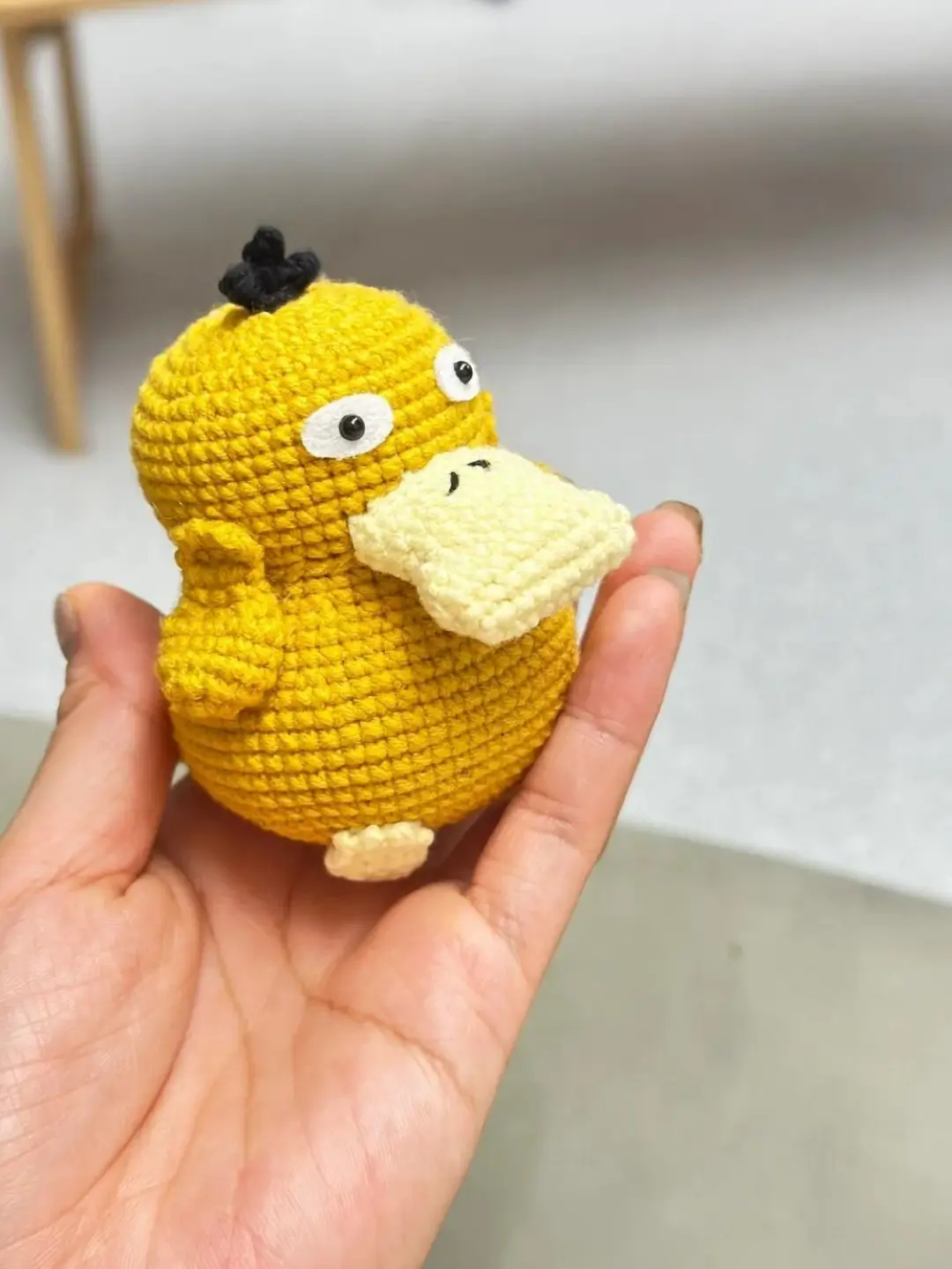 Crocheted yellow duck,  Pikachu's friend.